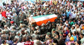 PHOTOS: Nation bids tearful adieu to its fallen heroes