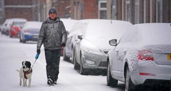 PHOTOS: Snow bomb hits UK, road, air travel disrupted