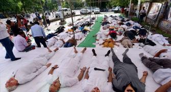 UP farmers perform shavasana in protest