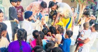 Opposing 'selective ban', Delhi BJP leader distributes crackers to children