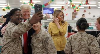 US can't be world's police, says Trump as he makes surprise visit to Iraq