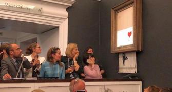 Banksy painting 'shreds itself' after being sold for $1.4 million
