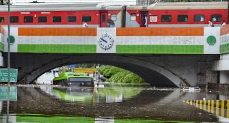 1 dead as rain lash Delhi, bus stuck under bridge