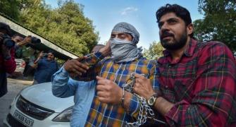 Delhi riots: Man who pointed gun at cop seeks release