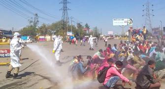 Workers hosed down with chlorine, opposition outraged