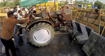 Farmers block Haryana roads, burn farm bills in Punjab