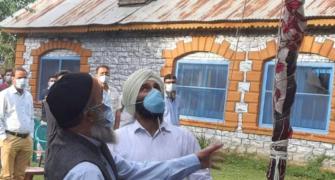 Terrorist Burhan Wani's father hoists tricolour in JK