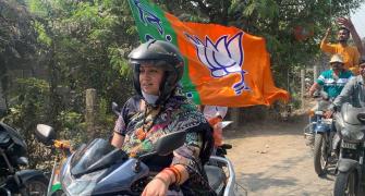 Bengal polls: Smriti Irani leads BJP rally on scooter
