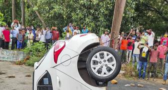 PIX: Car swallowed by Delhi road in monsoon