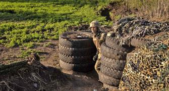 Ukrainian Troops Strip Russian Vehicles