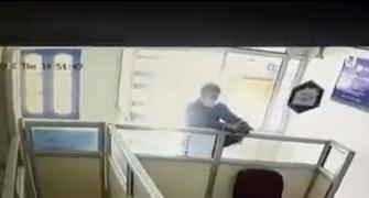 CCTV footage shows terrorist shoot at bank employee