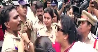 Renuka Chowdhury holds cop by collar during protest