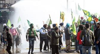 Farmers pause Delhi march after cops open water cannon