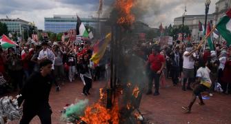 Netanyahu in Congress, protestors burn US flag outside