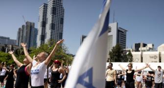 Amid war, hundreds join Yoga Day events in Israel
