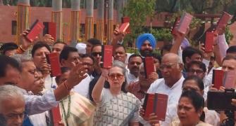 Oppn protests in Parl with Constitution copies in hands