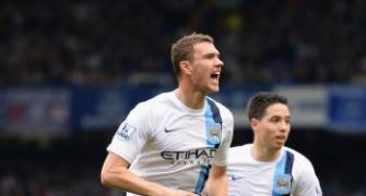 Man City back on top after Dzeko double downs Everton