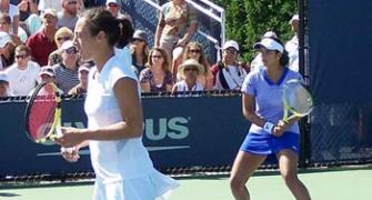 Sania out of doubles, Bhupathi advances