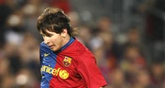 Messi double helps Barcelona rout Atletico