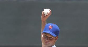 First Look: Prince Harry tosses ceremonial pitch