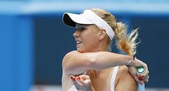 Glam girls Wozniacki, Sharapova record easy wins