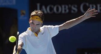 Aus Open Images: Federer marches on, Kuznetsova ousts Henin