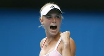 Gritty Wozniacki sees off Schiavone