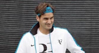 Federer overcomes feisty Portuguese