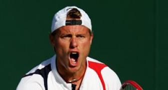 Hewitt soldiers on, Tomic claims biggest win