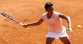 Images: Djokovic, Schiavone off to a blazing start