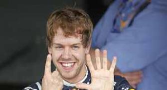 Vettel takes record pole in Brazil