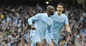 Man City go top, while Chelsea's Torres sent off