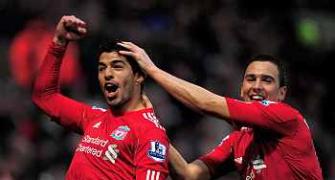 Suarez treble lifts Liverpool, defeat for Newcastle