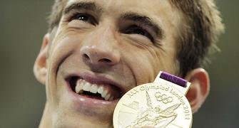 Phelps defies belief to become history-maker