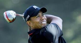 Tiger toils at Olympic, slips five off the pace