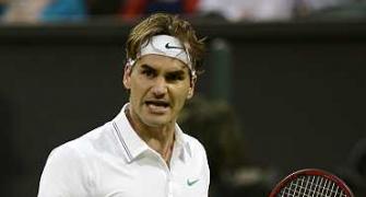 Federer survives five-set thriller to reach last 16