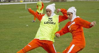 Football body approves goal-line technology, hijab