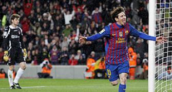 Record man Messi helps Barca close gap on Real