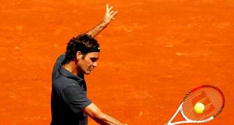 PHOTOS: Federer equals record, Azarenka survives
