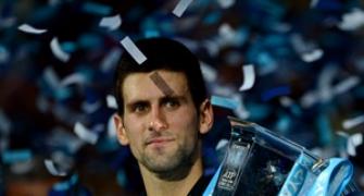 Djokovic grinds down Federer to win World Tour Finals