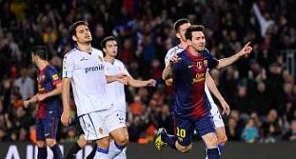 Messi nets another double as Barcelona march on