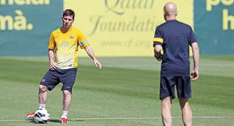 Barca's Messi returns to training camp