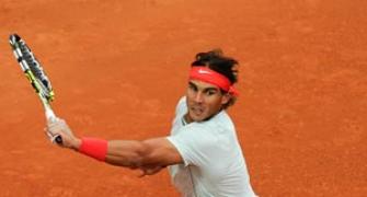 Nadal routs Raonic to close on eighth Barcelona title