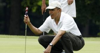 In a first, Obama playing golf with Tiger Woods