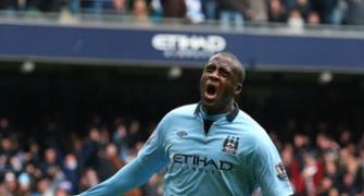 Toure, Tevez strike to give City glimmer of hope