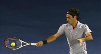 Federer puts journeyman Jaziri in his place after blip