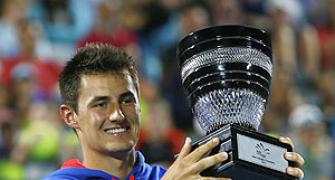 Tomic, Hewitt give locals hope; Ferrer equals record