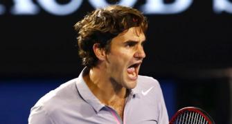 PHOTOS: Federer schools Raonic to reach last eight