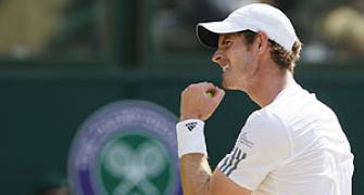 Murray lifts Wimbledon title, makes history
