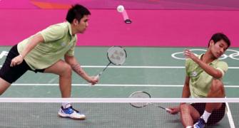Former badminton doubles partners exchange blows on court